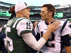 Tom Brady #12 of the New England Patriots shakes hands with Josh McCown #15 of the New York Jets after his team's 27-13 win at MetLife Stadium on November 25, 2018 in East Rutherford, New Jersey.