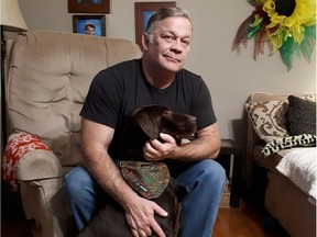 Dan Labonte, a retired Canadian Forces veteran, is shown with Zeek Dawg. Labonte and his wife, Janet, breed Labrador retrievers just outside of Wallaceburg, including service dogs for individuals with post-traumatic stress disorder.