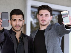 Young entrepreneurs Miraj Hussain, left, and Salvatore Loria display their Deliverbae app during 5th annual Entrepreneurial Summit held at Fogolar Furlan Club of Windsor November 19, 2018.