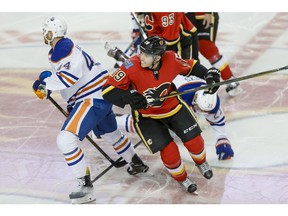 Calgary Flames forward Matthew Tkachuk and Edmonton Oilers counterpart Zack Kassian. Postmedia file photo.