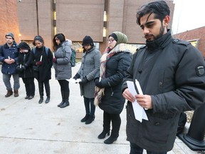 Members of Muslim Association (MLAWS) at Windsor Law have a moment of silence during a vigil to raise awareness for the ongoing humanitarian crisis in Yemen.  Described by the UN as the world's worst humanitarian crises, the conflict in Yemen has continued into its fourth year. Currently there are 22 million people who require aid and protection. Vigil speakers Mariam Rajabali, centre,  Mariam Jammal and Aadil Nathami, right, were joined by about two dozen students at the University of Windsor's Ianni (Ron. W) Faculty of Law November 27, 2018.