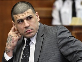 FILE- In this Dec. 27, 2016, file photo, former New England Patriots player Aaron Hernandez appears in Suffolk Superior Court for a pretrial hearing before Judge Jeffrey Locke in Boston. Opening statements are scheduled for Wednesday, March 1, 2017, in the double murder trial of ex-NFL star Hernandez.