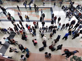 On the busiest travel day of the year, family and friends watch for arrivals of loved ones, at Denver International Airport on Nov. 27, 2013.