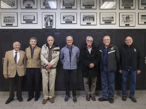 Alumni, from left, Edward Alice, Frank Chick, and Phillip Milan, from the class of 1948, and  Drew Mathany, Charles West, John Lesperance, and Bob Carter, from the class of 1968, are pictured in the hallway of Assumption Catholic High School before attending the 50th and 70th reunion of the school, Saturday, November 3, 2018.