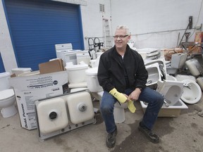 Rick Young, Habitat for Humanity's regional ReStore manager, pictured with kevlar sleeves after he cut his wrist from a porcelain toilet that required three units of blood, Tuesday, November 27, 2018.