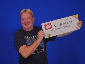 John Cotey of Chatham is shown with a $50,000 cheque for his winnings through the Ontario 49 draw. The 53-year-old truck driver said he plans to invest in an RRSP and a down payment on a house. (Handout)