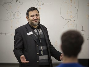 University of Windsor Dean of Computer Science, Ziad Kobti, teaches coding to grade 12 students from L'Essor High School, at the University of Windsor, Friday, November 2, 2018.