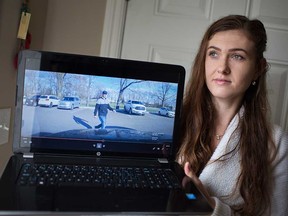 Vanessa Donais, 24, of Windsor, shows her dashcam video recording of a man who tried to enter her mother's parked vehicle at the Edinborough Business Centre on Nov. 21, 2018.