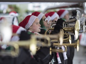 On a note of charity. The Diplomats Drum and Bugle Corps perform outside the Real Canadian Superstore on Walker Road on Nov. 24, 2018, while collecting food and money for the Unemployed Help Centre's food bank.