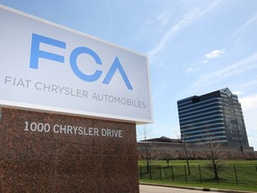 The Fiat Chrysler sign is unveiled at Chrysler World Headquarters in Auburn Hills, Mich. on May 6, 2014.
