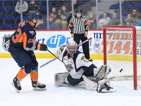 Windsor Spitfires goalie Kari Piiroinen stretches to make a save on Flint Firebirds forward Eric Uba during Friday's game at the Dort Federal Event Center. Photo credit to Todd Boone / Flint Firebirds