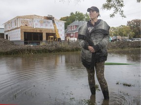 Richelle Dolan, who lives at 1010 Front Rd. in Lasalle, surveys flooding at Gil Maure Park, that she says flows onto her adjacent property, Friday, November 2, 2018.