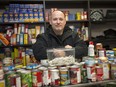 Windsor's Leo Lucier, owner of Compassion House, holds a container filled with rolled marijuana joints on Nov. 23, 2018. The pot activist was giving them away this past week in exchange for food and clothing donations for the needy.