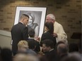 Former Windsor mayor Eddie Francis, with his children Sienna (right) and Phoenix, attend the funeral service for his late wife and their mother, Michelle Prince, at Corpus Christi Church on Nov. 23, 2018.  Prince died November 18 after a long and public battle with cancer.