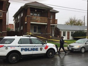 Windsor police collect crime scene tape in the 250 block of Giles Boulevard East after a homicide investigation on the morning of Nov. 1, 2018.