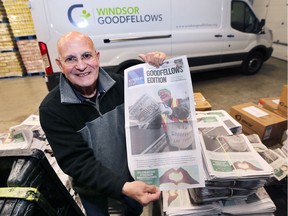 Gilbert Barichello, president of the Windsor Goodfellows organization poses with this season's version of the Goodfellows newspaper on Tuesday, Nov. 20, 2018. The edition features former Windsor Star reporter Ted Whipp on the front page. Whipp passed away in August.
