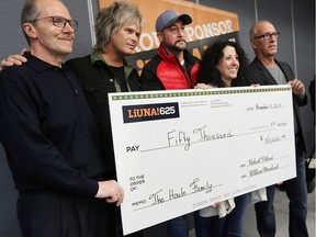 A fundraiser for Kaleb Houle's family has raised $50,000 to date. The 13-year-old died on the weekend after a long battle with cancer. Pictured from left on Tuesday, November 13, 2018, with the ceremonial cheque are Tom Harris, Harris Marketing, Jeff Burrows and Dave Hunter, fundraising organizers, Cathy Zaharchuk and Bill Moreland, LIUNA 625.