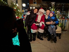 Ho! Ho! Ho! Alyssa Richmond and her two children, Alyiah Butler, 9 (left) and Madden Butler, 3, pose for a photo with Santa at The Inn of Windsor on Nov. 16, 2018, during the annual Walkerville Holiday Walk. Continues Saturday.