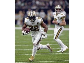 New Orleans Saints running back Mark Ingram (22) carries for a touchdown in the first half of an NFL football game against the Philadelphia Eagles in New Orleans, Sunday, Nov. 18, 2018.
