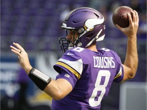 FILE - In this Sept. 23, 2018, file photo, Minnesota Vikings quarterback Kirk Cousins warms up before an NFL football game against the Buffalo Bills, in Minneapolis. The Vikings host the Detroit Lions on Sunday, Nov. 4.