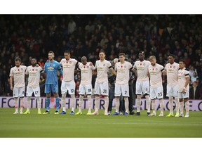 Manchester United players observe a minutes silence for Armistice Day and also the victims of the Leicester helicopter crash, which included Leicester Chairman, Vichai Srivaddhanaprabha before the Premier League soccer match between Bournemouth and Manchester United at The Vitality Stadium, Bournemouth, England. Saturday Nov. 3, 2018.