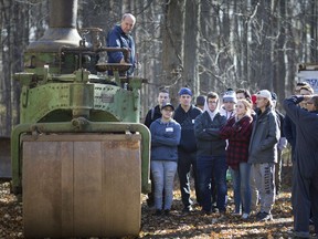 Al Kiernan, a volunteer at the Canadian Transportation Museum, shows students in the specialist high skills major transportation programs from various county high schools, an old steam powered roller at the Canadian Transportation Museum, Wednesday, November 14, 2018.