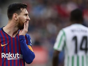 FC Barcelona's Lionel Messi gestures during the Spanish La Liga soccer match between FC Barcelona and Betis at the Camp Nou stadium in Barcelona, Spain, Sunday, Nov. 11, 2018.