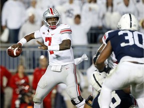 FILE - In this Saturday, Sept. 29, 2018 file photo, Ohio State quarterback Dwayne Haskins Jr. throws a pass against Penn State during the second half of an NCAA college football game in State College, Pa. Last year's Ohio State hero has to try to beat Michigan again in The Game. Backup quarterback Dwayne Haskins Jr. entered the game in the third quarter because an injury to starter J.T. Barrett. Haskins sparked a touchdown drive and an eventual 31-20 win over the Wolverines in Ann Arbor. Now the starter, Haskins will lead the No. 10 Buckeyes against No. 4 Michigan on Saturday at Ohio Stadium. Ohio State enters the game in an unfamiliar position _ underdog.