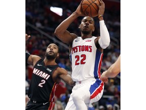 Detroit Pistons guard Glenn Robinson III (22) passes as Miami Heat guard Wayne Ellington (2) defends during the first half of an NBA basketball game, Monday, Nov. 5, 2018, in Detroit.