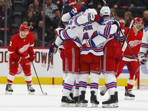 New York Rangers' Neal Pionk (44) celebrates his goal against the Detroit Red Wings in the second period of an NHL hockey game in Detroit, Friday, Nov. 9, 2018.