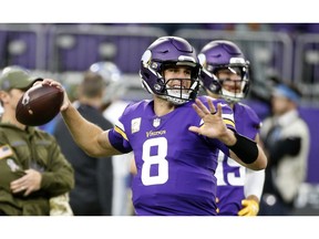 Minnesota Vikings quarterback Kirk Cousins warms up before an NFL football game against the Detroit Lions, Sunday, Nov. 4, 2018, in Minneapolis.