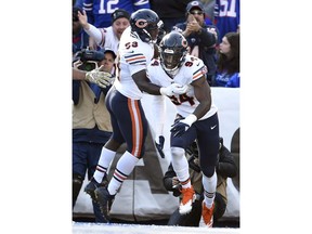 Chicago Bears outside linebacker Leonard Floyd (94) celebrates with teammates after intercepting a pass to score a touchdown during the first half of an NFL football game against the Buffalo Bills Sunday, Nov. 4, 2018, in Orchard Park, N.Y.