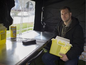 Brandon Bailey, a member of the Windsor Overdose Prevention Society, sits in a mock overdose prevention site outside Victoria Manor in downtown Windsor, Saturday, November 3, 2018.