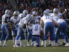 FILE - In this Nov. 11, 2018, file photo, Detroit Lions quarterback Matthew Stafford huddles with teammates during the first half of an NFL football game against the Chicago Bears in Chicago. After three consecutive losses, the Lions host Carolina on Sunday. That game is followed by a Thanksgiving matchup with Chicago and another home test against the NFC West-leading Rams. There's time for Detroit to rally, but the path forward looks difficult.