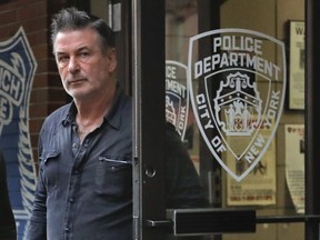 Actor Alec Baldwin walks out of the New York Police Department's 10th Precinct, Friday, Nov. 2, 2018, in New York.