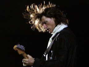 FILE - In this Saturday, June 2, 2007, file photo, American rock band Aerosmith's guitarist Joe Perry performs during a concert in Bangalore, India. Perry is hospitalized with breathing problems that began after a performance with Billy Joel in New York. Perry's publicists said in a statement that he's alert and responsive in the hospital Sunday, Nov. 11, 2018.