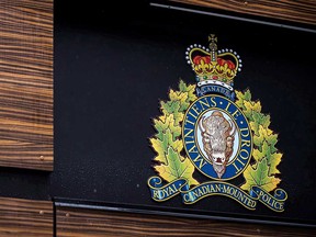 Logo of Royal Canadian Mounted Police outside division headquarters in Surrey, B.C., in April 2018.