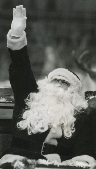 Santa Claus waves to the crowd during the 1986 parade.