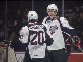 WINDSOR, ONT:. NOVEMBER 11, 2018 -- Windsor's Curtis Douglas celebrates with teammate Luke Kutkevicius after Douglas' second goal of the game between the Windsor Spitfires and the Saginaw Spirit at the WFCU Centre, Sunday, November 11, 2018.