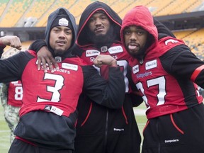 Calgary Stampeders defensive back Patrick Levels (3), linebacker Wynton McManis (48) and linebacker Maleki Harris (37) joke around takes part in a team walk though of Commonwealth Stadium in Edmonton, Saturday, November 24, 2018. The Ottawa Redblacks will play the Calgary Stampeders in the 106th Grey Cup on Sunday.