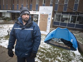 Greg Lemay, former Ward 8 council candidate, stands on Ouellette Avenue in front of the Downtown Mission, after spending 48 hours on the street, Sunday, November 18, 2018.