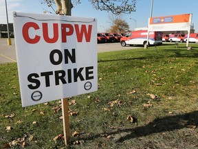 A picket sign is shown in front of the Canada Post facility on Wednesday, Nov. 14, on Walker Road in Windsor.