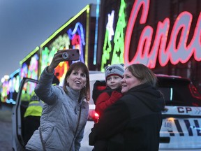The Canadian Pacific Holiday Train rolled into Windsor on Nov. 30, 2018, with lots of lights, music — and Santa. Among the thousands who attended, Jill Bubenheimer, left, Corbin Davenport and Jodi Davenport came from Detroit to see the train.