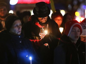 A vigil for victims of homicide in the city this year was held near the City Hall Square on Wednesday, Nov. 28, 2018. Participants are shown during the event.