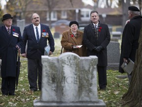Ross Wigle, centre right, and his wife, Gloria Pizio, are joined by Major Andy Stewart, Windsor Regiment Association squadron leader, and John Celestino, president of the Windsor Regiment Association, at Windsor Grove Cemetery on Nov. 10, 2018, for a commemoration of former Windsor mayor, and WW1 veteran Ernest S. Wigle.