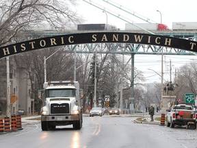 Motorists drive under the newly installed Sandwich Town arch which is located west of the Ambassador Bridge.  Facca Inc. completed the installation Thursday.