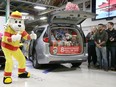 FCA Canada officials, Unifor Local 444 executives and members, invited guests and media gathered at the FCA Windsor Assembly Plant on Dec. 7, 2018, as generous donations to United Way/Centraide Windsor-Essex County and Sparky's Toy Drive were announced. Sparky gives his thumbs up to the donation of toys which filled eight Chrysler Pacificas.