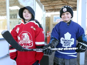 Keegan Davis, 7, left, and Tristen Humber, 8, are two of the hundreds of children who get to play hockey because of Knobby's Kids at Lanspeary Park.  St. Clair College Alumni Association donated $5,000 on Saturday morning, which was the first ice time of the 2018-19 hockey season for Knobby's Kids.