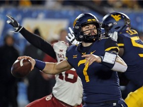 Will Grier of the West Virginia Mountaineers passes against the Oklahoma Sooners on Nov. 23, 2018 at Mountaineer Field in Morgantown, West Virginia.