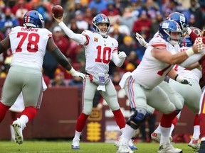 Quarterback Eli Manning #10 of the New York Giants passes in the first quarter against the Washington Redskins at FedExField on December 9, 2018 in Landover, Maryland.
